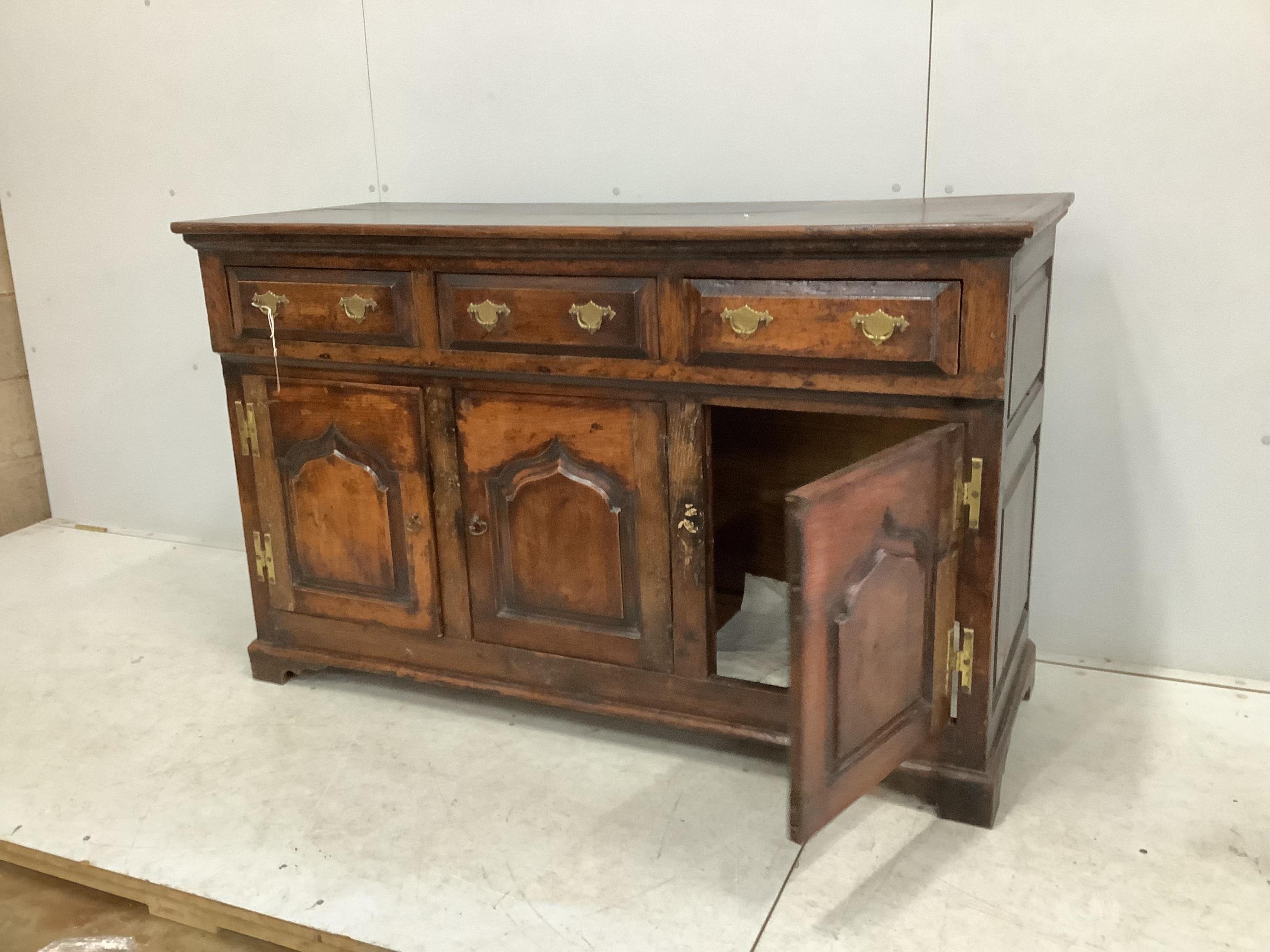 An 18th century oak low dresser, width 142cm, depth 55cm, height 88cm. Condition - fair